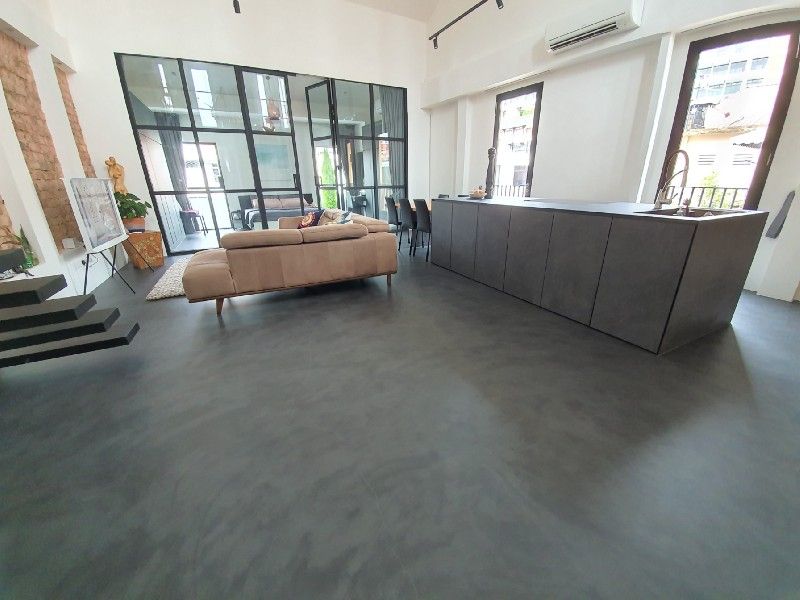Seamless cementitious flooring in a residential unit